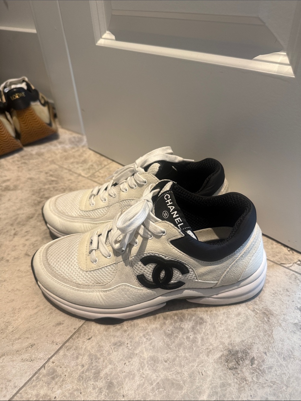 CHANEL White Sneakers with Black Logo Trim